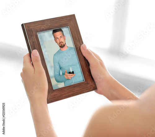 Female hands holding photo ...