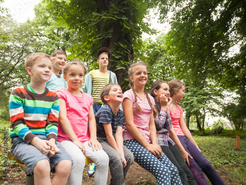 Group of children on a park bench