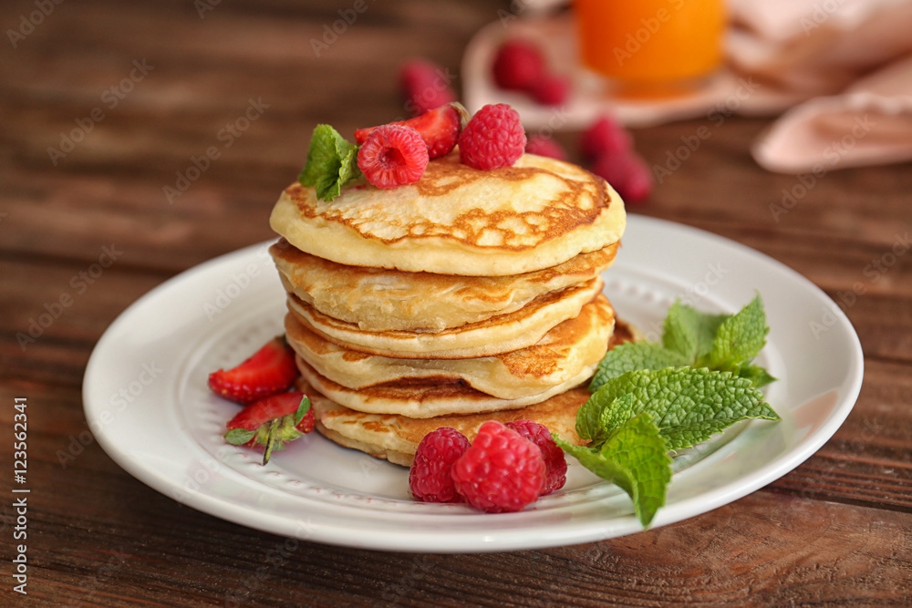 Tasty pancakes with berries on plate Tasty pancakes with berries on plate