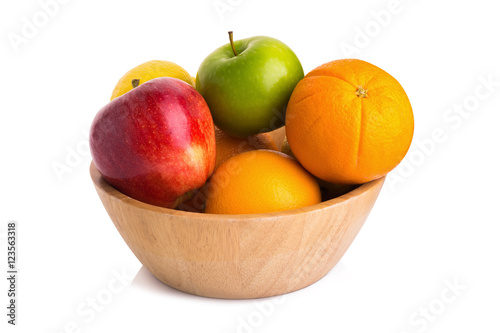wooden bowl with fruits isolated on white