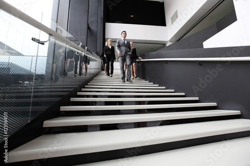 Business people on stairs