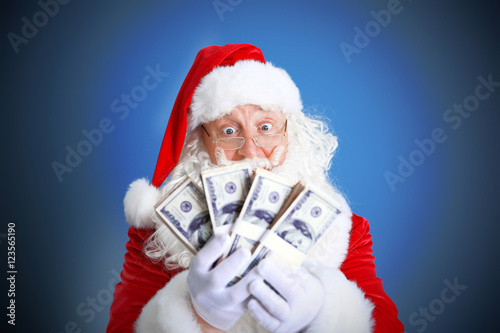 Santa Claus holding money o...