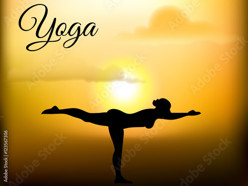 The girl is engaged in yoga on the sun dawn