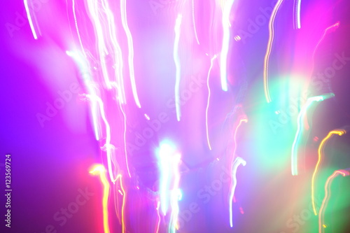 Chaotic lights in moriol blur out of focus - abstract photograph background.