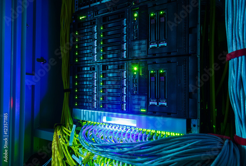 Obraz na plátně Network switch and UTP ethernet cables close-up in the server room