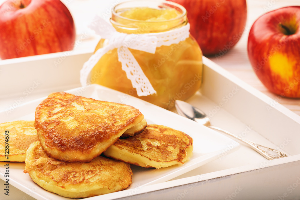 Pancakes with apple jam on white plate. Pancakes with apple jam on white plate.