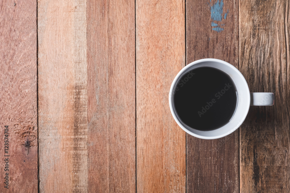 Top view of Coffee cup on wooden table background. Free space for text Top view of Coffee cup on wooden table background. Free space for text