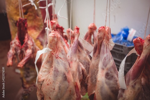 Peeled red meat hanging in the storage room