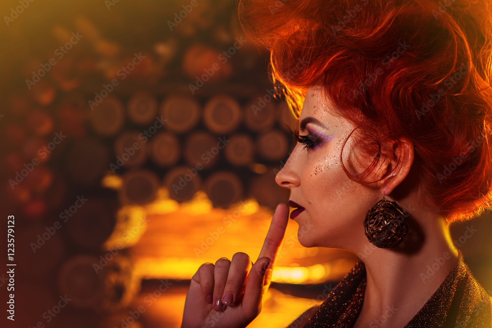 Fototapeta premium Model Girl in Autumn style at wooden fireplace background. Fashion Portrait. Creative make-up and hairstyle