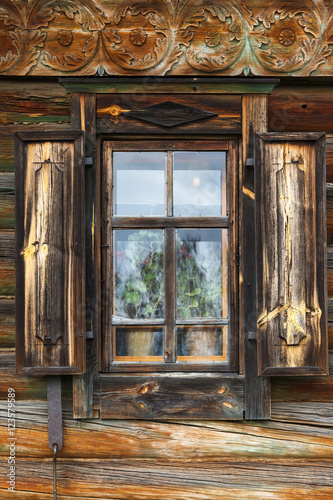 Carved window of old wooden house