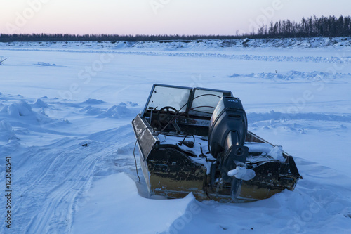 Motor boat in the snow. Indigirka River, Yakutia, Russia.