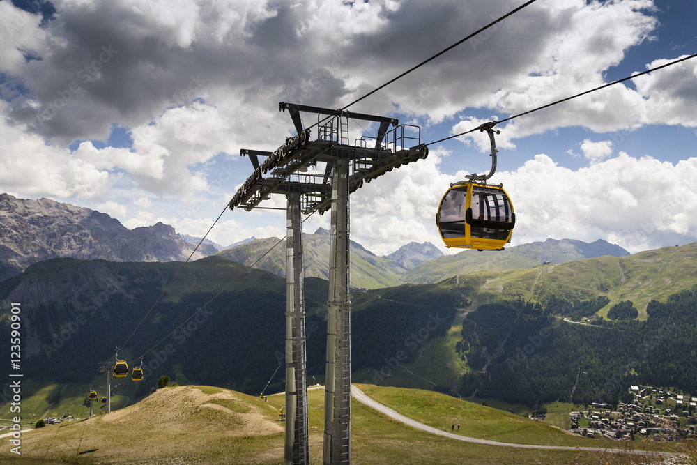 Cable car gondola in Alps mountains near Livigno lake Italy