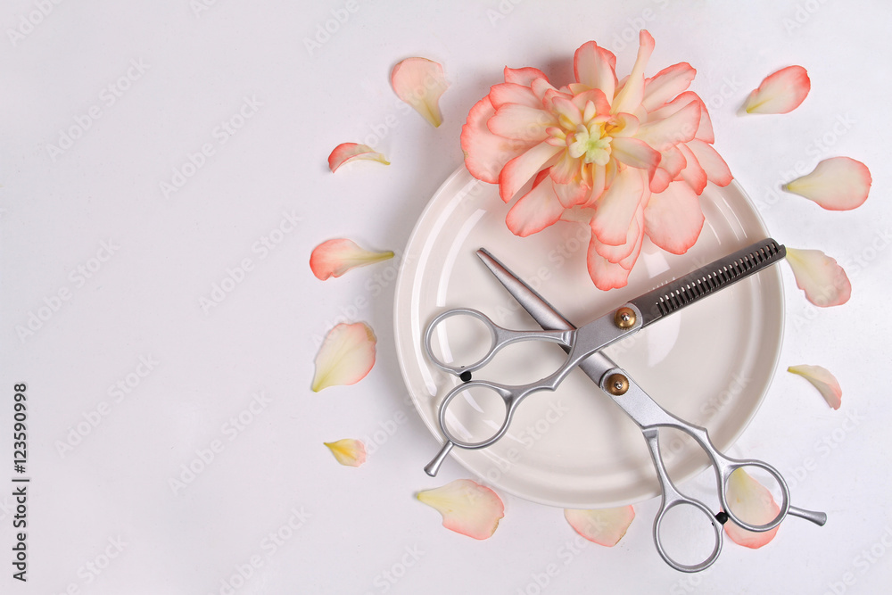 Scissors white background. Hairdresser salon concept. Creative arrangement made from flowers and pentals. Haircut accessories, flat lay, copy space