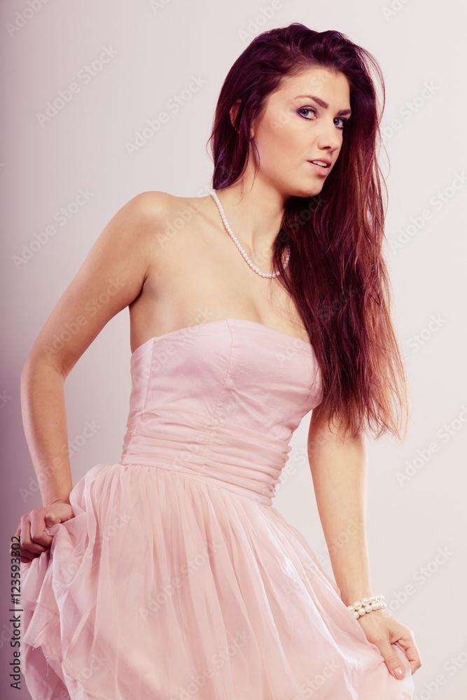 Fototapeta premium Brunette woman in bright dress