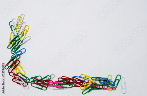 Colorful paper clips isolated in white