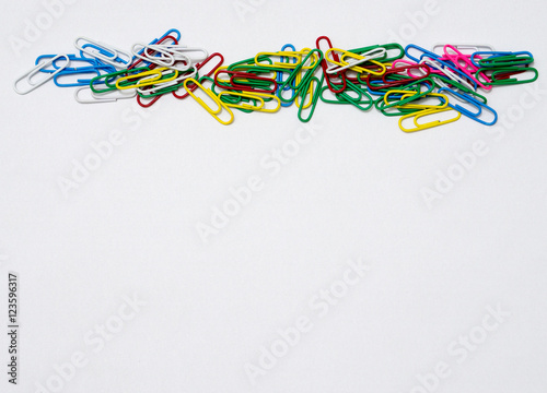 Colorful paper clips isolated in white