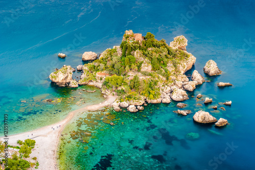Beautiful landscape of Taormina, Italy. Sicilian seascape with beach and island Isola Bella. Travel photography. photo