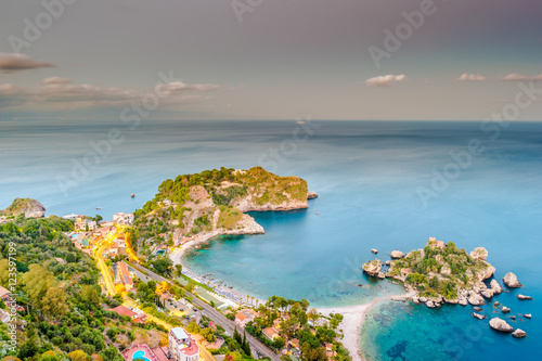 Beautiful landscape of Taormina, Italy. Sicilian seascape with beach and island Isola Bella. Travel photography.