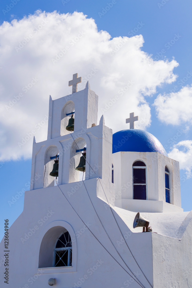 White orthodox church bell tower. Oia, Santorini Greece. Copyspace