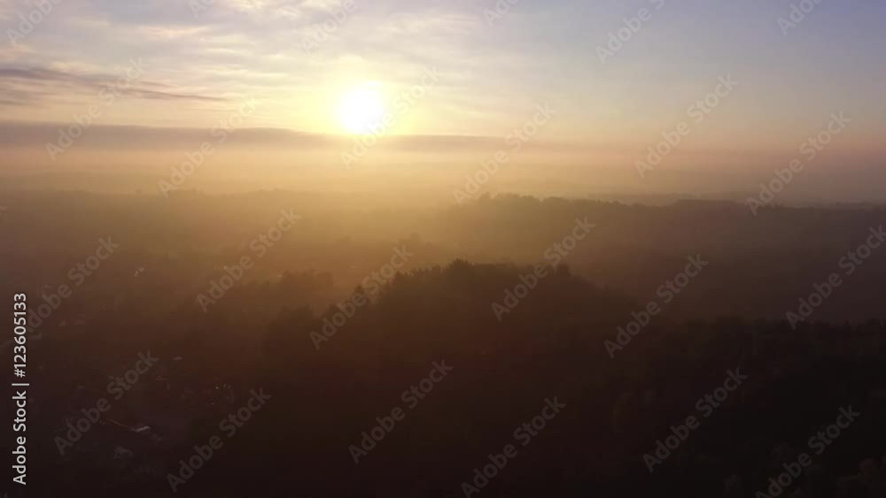 Aerial view of sunrise on a misty day. Aerial view of sunrise on a misty day.