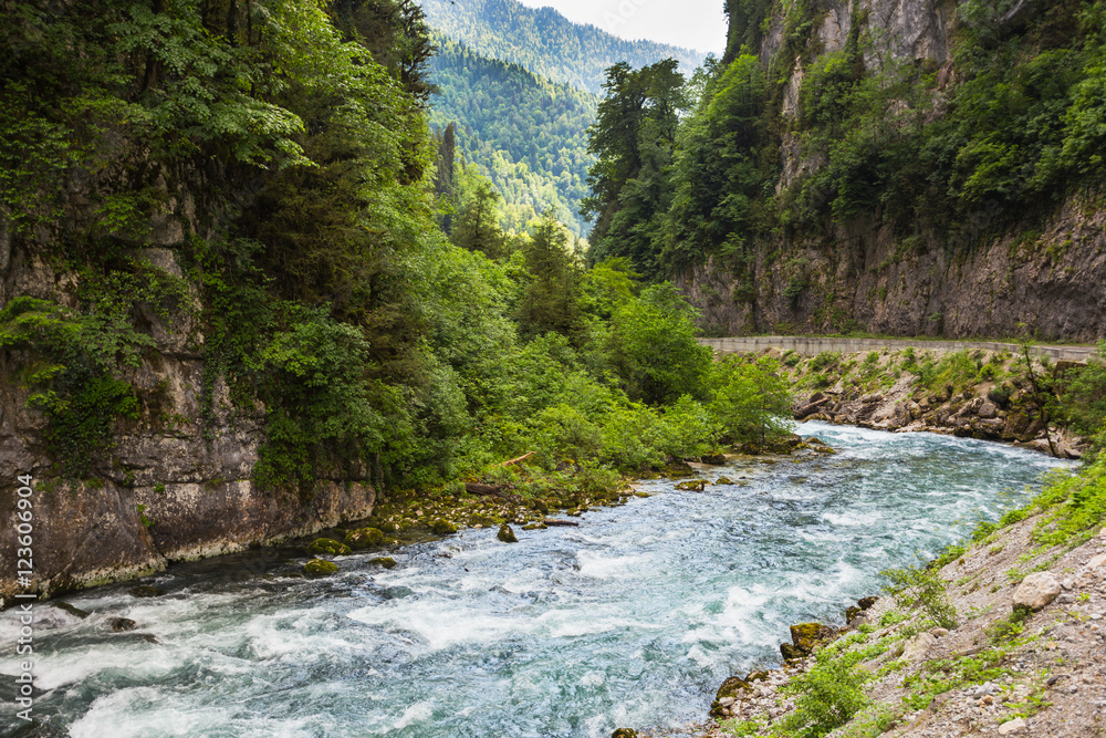 Landscape in Abkhazia with Caucasian ridge and river Landscape in Abkhazia with Caucasian ridge and river