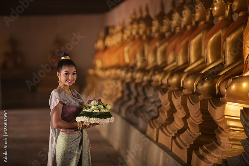 Women in Thai dress at the old temple. Noppamas Queen Contest in Loy kratong tradition.

