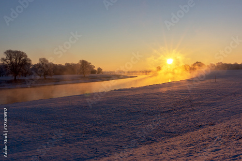 Fog at the Elbe river near Torgau during a winter sunrise