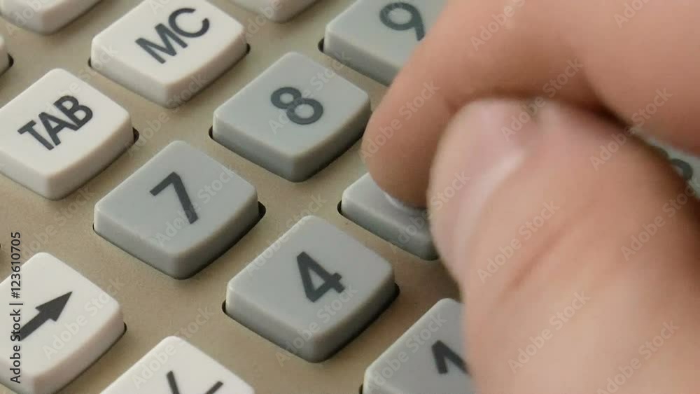 The video shows calculation on the calculator background closeup The video shows calculation on the calculator background closeup