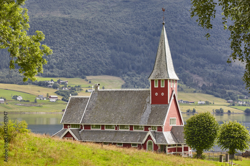 Traditional norwegian red stave church. Rodven. Travel Norway. photo