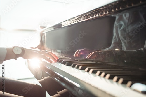 Woman playing a piano photo