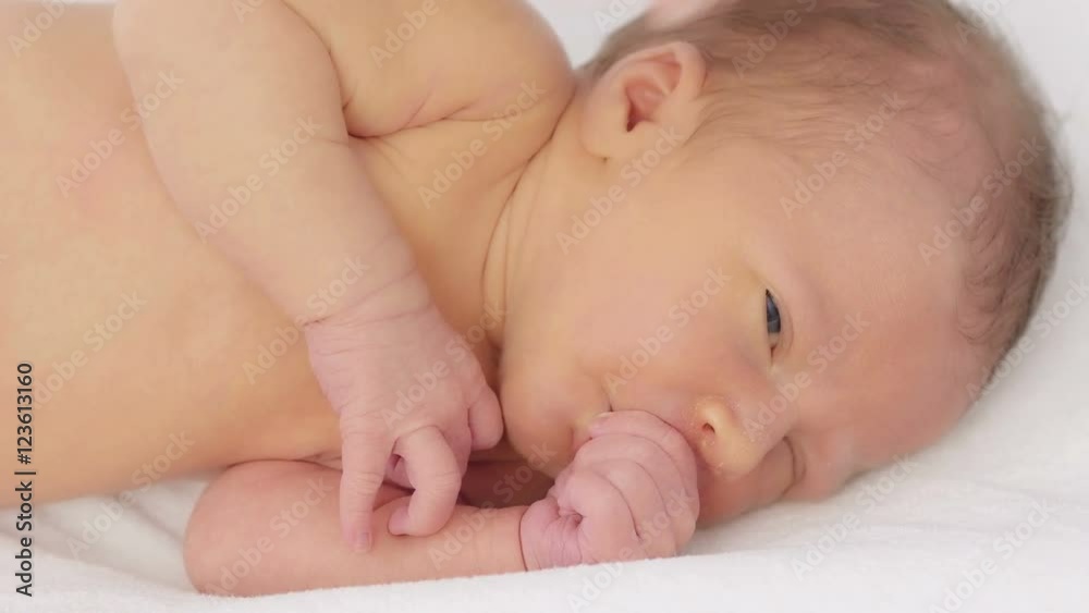 Sleeping newborn baby in blanket. Close up.
Sleeping newborn baby in blanket. Close up.