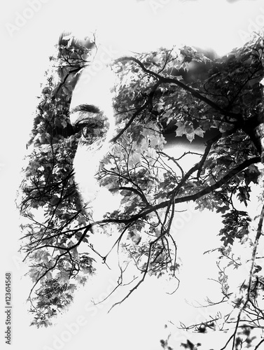 Double exposure of beautiful girl and leaves black and white