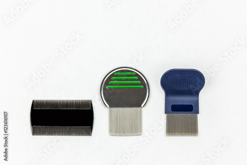 Three different kinds of lice combs. Studio shot on white background with copy space. 