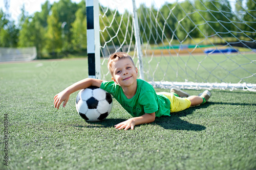 Young child playing football