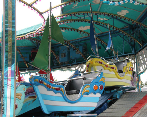 The Seats of a Childrens Fun Fair Sail Boat Ride. © daseaford