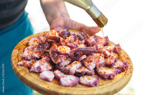 Galician style cooked octopus with paprika and olive oil. Pulpo photo