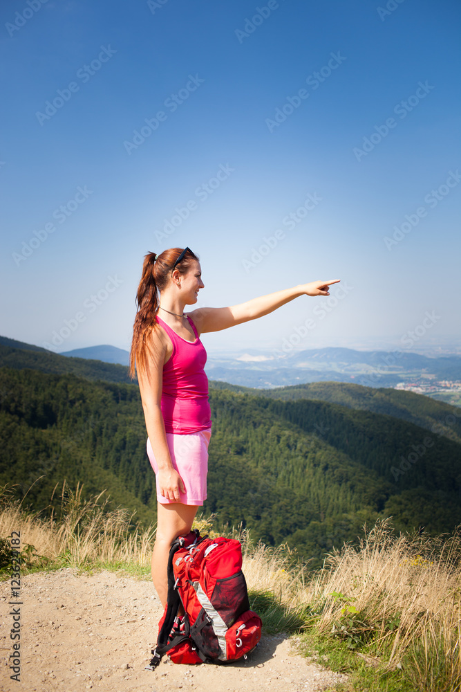 Beautiful young woman/girl/female tourist during hiking the mountain/ trekking/backpacking trip and enjoying the panorama in Beskydy in Czech  Republic Stock Photo