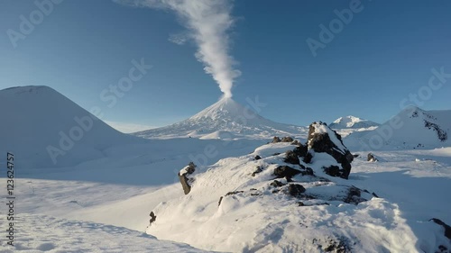 Volcanic landscape of Kamchatka: eruption Klyuchevskoy Volcano (Klyuchevskaya Sopka), gas-steam activity of volcano, explosive-effusive erupting. Klyuchevskaya Group of Volcanoes. (time lapse, 4K)