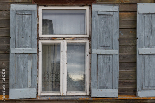 The building window with wooden shutters