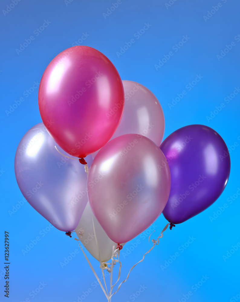 colored balloons on a blue background