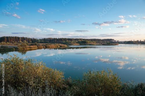 Fototapeta Naklejka Na Ścianę i Meble -  Pond in countryside in autumn at sunset