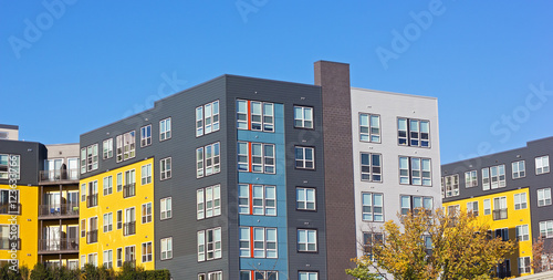 Suburban residential development of Washington DC metropolitan area. Colorful apartment building in early autumn.