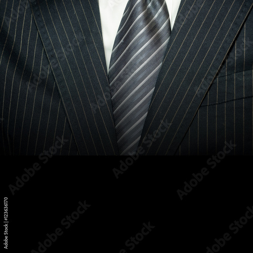 Man in suit on a black background.