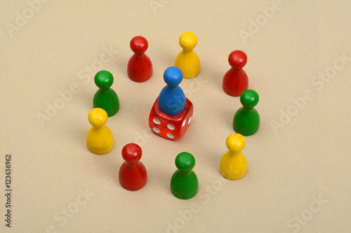 Leadership Concept with colorful pawns and dice