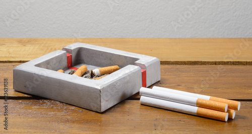 Фотография cigarette and ashtray on table