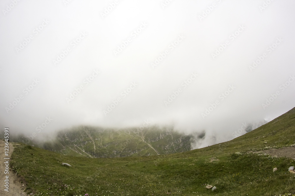 Landscape from Bucegi Mountains, part of Southern Carpathians in Romania in a very foggy day