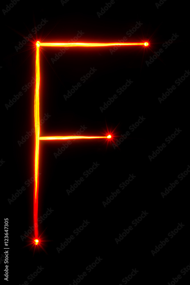 Obraz premium red light painting letter F on black background