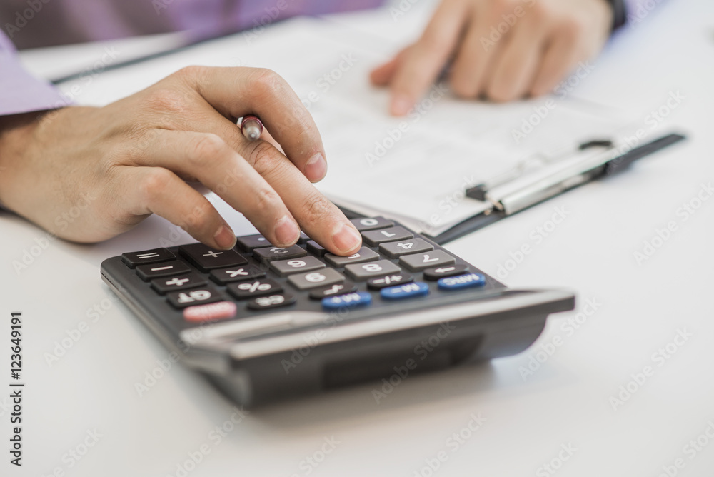 planner with pen and calculator on the table planner with pen and calculator on the table