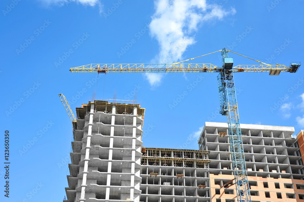 Crane and highrise construction site Crane and highrise construction site