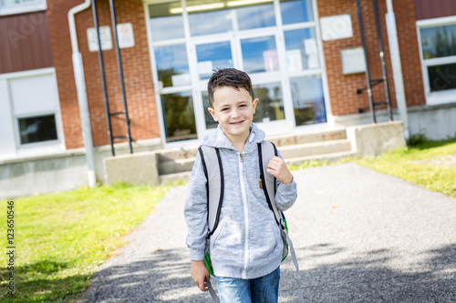 student outside school standing smiling © Louis-Photo